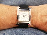 a person that is wearing a watch on his wrist