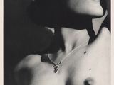 black and white photograph of a woman with a necklace on her neck