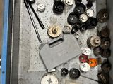 an overhead view of a metal box with various tools in it
