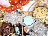 a close up of a bunch of jewelry on a table