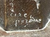 a close up of a piece of metal with writing on it