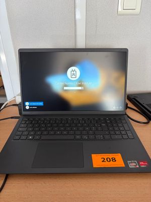 a laptop that is sitting on a desk with a price tag on it