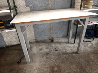 a white desk with a wooden top in a room