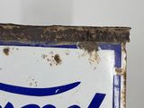 a blue and white sign on a white wall