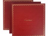 a set of three red cards with gold trimming