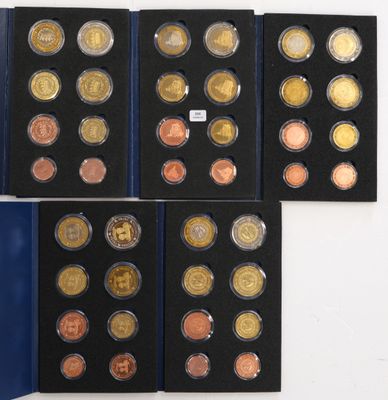 a collection of coins from different countries including the united states