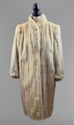 a white fur coat on a mannequin mannequin mannequin mannequin mannequin mannequin mannequin mannequin manne