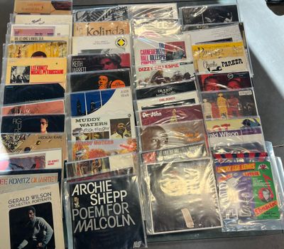 a lot of music cds on the table together