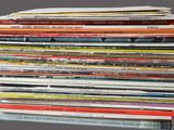 a lot of magazines stacked on top of each other