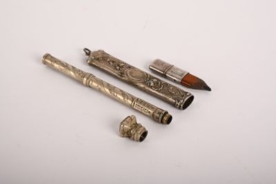 three different types of pens and a pipe on a white surface