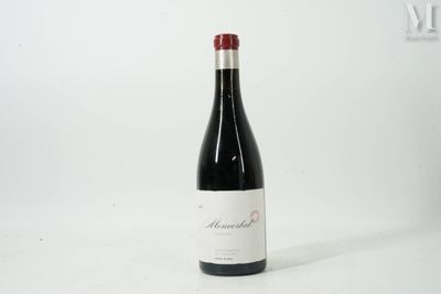 a bottle of wine that is sitting on a table