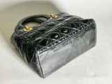 a black purse that is sitting on a table