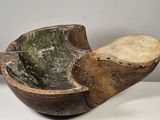 a wooden spoon with a wooden handle on a white table