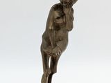 statue of a man with a hat on his head on a base