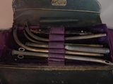 a bunch of tools in a case on top of a table