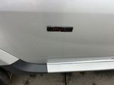 a close up of a car door with a sticker on it