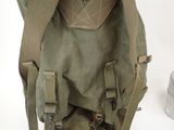 a backpack and a bowl of food on the table