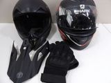 a helmet, gloves, and glove sitting on a table