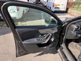 a car door open with the driver ' s side door open