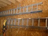 two ladders that are hanging on the wall