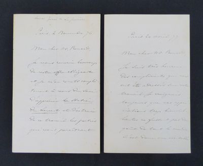 two handwritten letters on a piece of paper with a black background