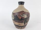 a vase with a picture of a man riding a horse on it