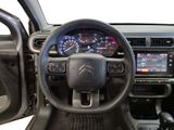 the interior of a car with a steering wheel, dashboard, and dash board
