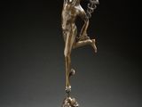 an image of a bronze statue of a woman on a pedestal