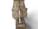 an image of a model of a sailing ship on a white surface