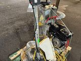 a machine that is sitting on a cart in the street