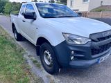 a picture of a white pick up truck parked on the side of the road