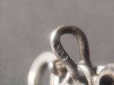 a close up of a metal hook on a table