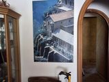 a picture on the wall above a chair in a living room