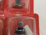 three boxed action figures of a police officer and a fireman