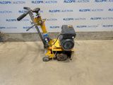 an image of a small machine that is sitting on the ground