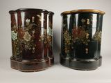 two black and gold vases with flowers on them