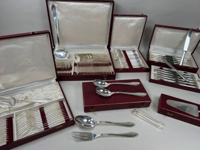 a lot of silverware in a case on a table