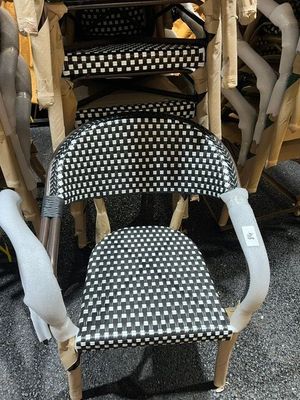 many chairs that are stacked on top of each other