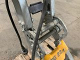 a close up of a fork on a pallet in a warehouse
