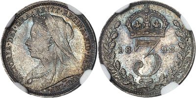 a close up of a coin with a crown on top of it