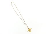 a gold plated necklace with a cross on a chain
