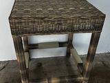 an image of a wicker side table with a wooden top