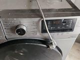 a washing machine that is sitting on the floor