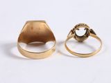two gold rings, one with a dragon and the other with a snake