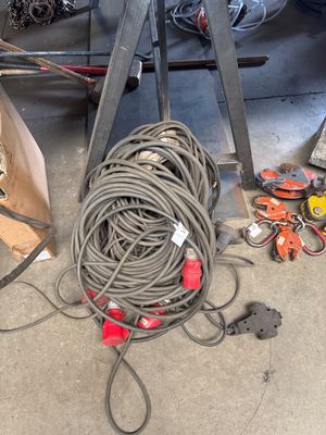 a lot of wires and tools on the ground