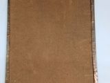 an image of a piece of brown paper on top of a white table