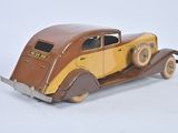 a toy car that is sitting on a white surface