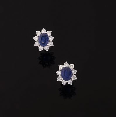 a pair of sapphire and diamond earrings