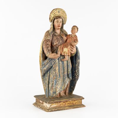 a statue of a woman holding a baby in her arms