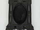 a black picture frame hanging on a white wall